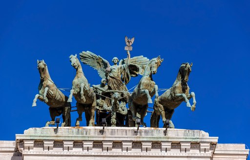 Statue on roof in Rome, Italy