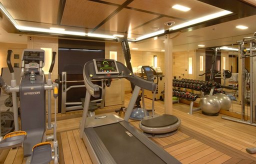 Fully equipped gym onboard yacht charter AMARYLLIS, with direct access to beach club area. 