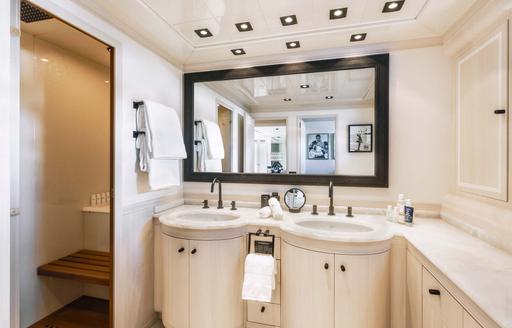 Overview of his and hers sinks in a guest cabin ensuite onboard boat charter MRS GREY