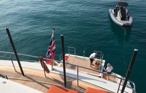 Swim platform and crew member onboard charter yacht ANDIAMO