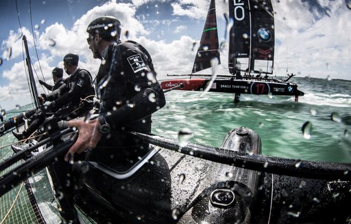 Up Close view of sailors on board catamaran competing in the America's World Cup Series New York