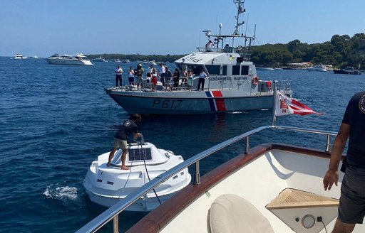 Man helping yacht moor using buoy in Mediterranean