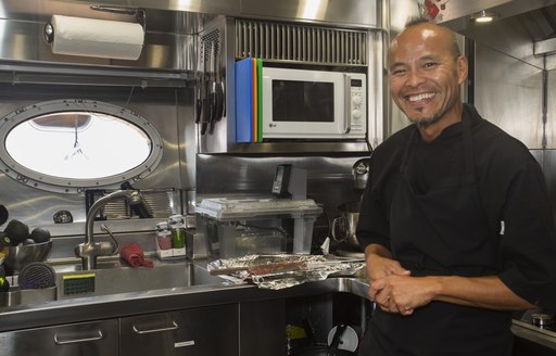 Chef Jean-Marc Masson in galley aboard superyacht BW at the 2017 Newport Charter Show