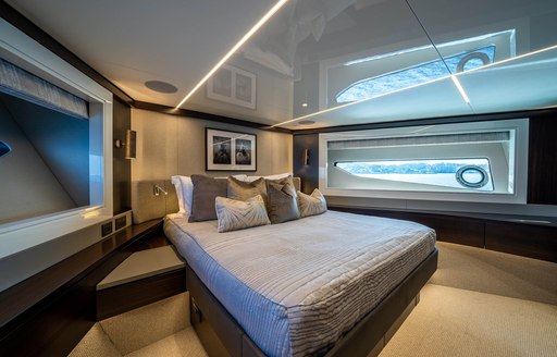 VIP cabin onboard charter yacht GLASAX, central berth with narrow window in the background