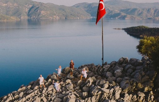 group of people on top of hill with panoramic views of Kapi Creek