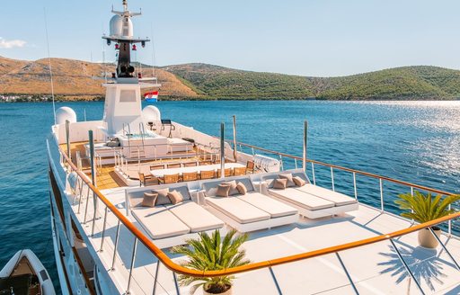 Charter yacht VICTORY sun deck overview with sun pads forward