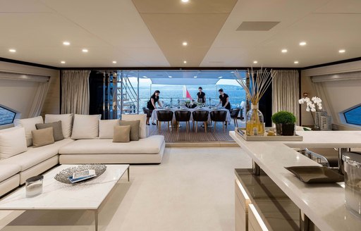 skylounge on luxury charter yacht jacozami,with bar and sofa seating