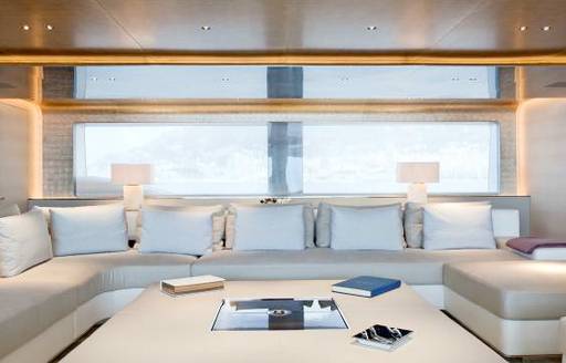 Interior seating with white sofas and cushions onboard charter yacht ASLEC 4