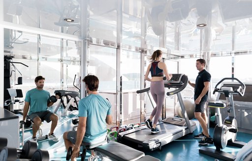 three best friends working out in their chrter yacht's gym