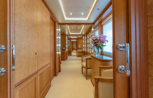 Corridor with small seating area onboard charter yacht AZUL V