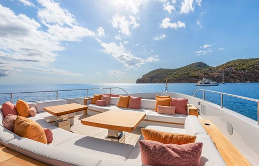 Exterior seating and sunpads onboard charter yacht LIV LOVE