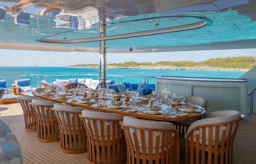 expansive alfresco dining area on the upper deck aft of charter yacht My Seanna