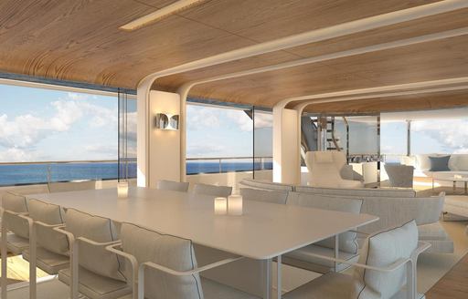 Interior dining area with long white table and chairs onboard charter yacht DAWO