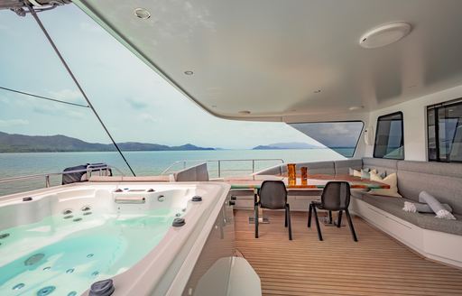 Deck Jacuzzi and exterior seating onboard sailing yacht charter CRAZY LOVE