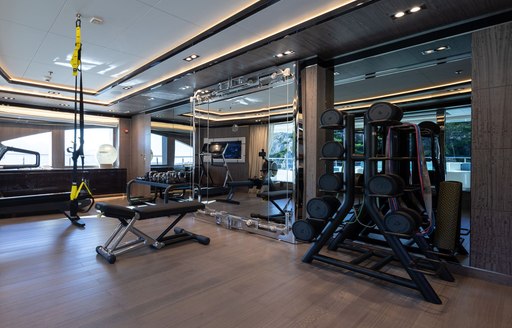 Overview of the gym with equipment onboard charter yacht O'PTASIA