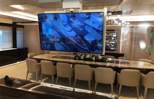 dining salon on luxury yacht opari with tv screen 