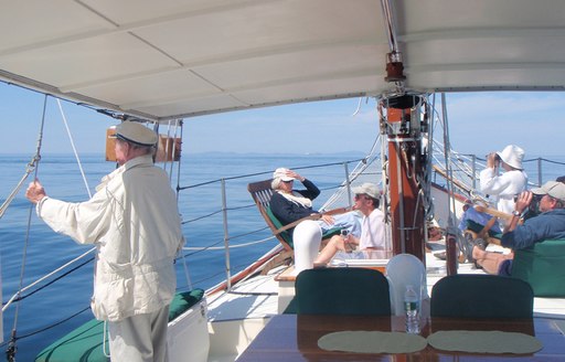 guests lounge and take in sights on foredeck of luxury yacht Bonnie Lynn