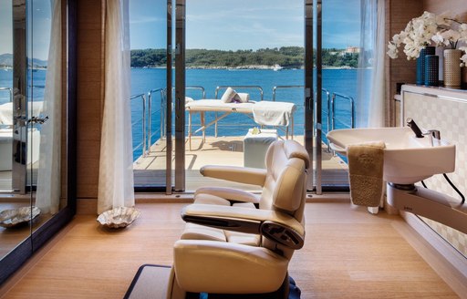 Beauty salon and massage table on fold-down balcony onboard charter yacht STARBURST IV