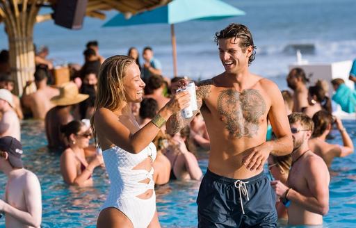 Finns VIP Beach Club Indonesia pool area, people