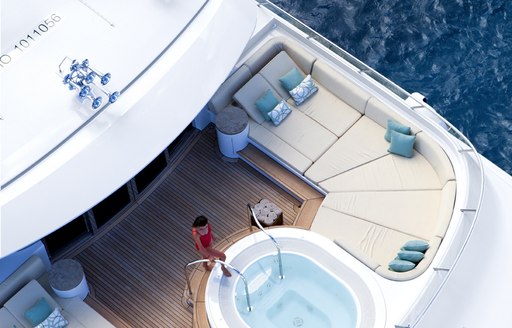 A charter guest entering the Jacuzzi on board a superyacht