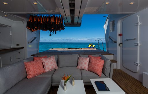 Sofa with beach club behind on Superyacht BACA