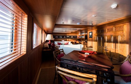 Elegant room with table and chairs on superyacht Bleu De Nimes