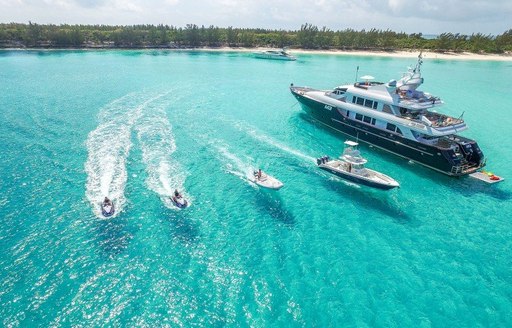 m3 yacht in the bahamas on a tropical vacation, aerial shot with tenders and jet-skis