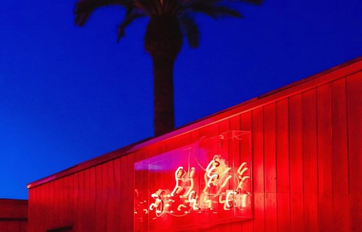 Exterior red light and palm tree by DC10 Circoloco Ibiza