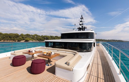 large foredeck with seating area on board luxury yacht ONEWORLD