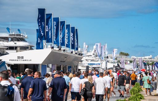 Line of exhibitors at FLIBS with many visitors exploring the dock