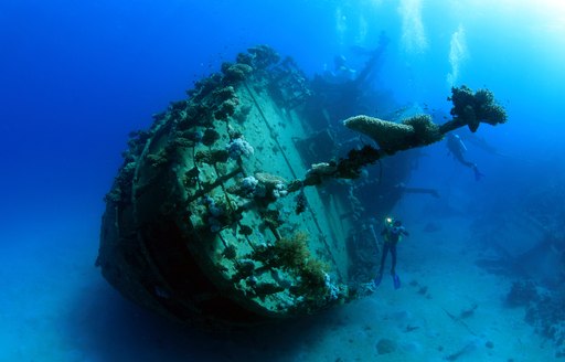 Scuba diver with shipwreck