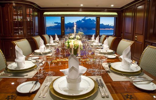 Charter yacht TELEOST dining table set for a meal