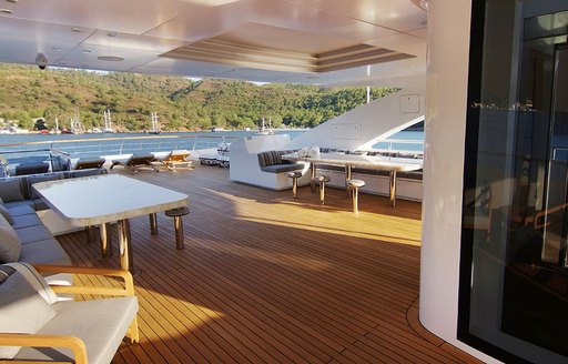 alfresco dining on baba's yacht with elevator in foreground