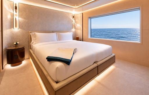 Charter yacht SYMMETRY guest cabin with large window