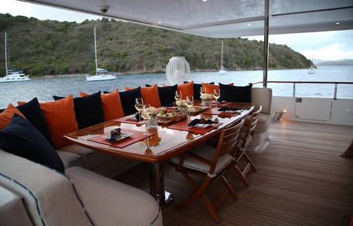 M4 yacht sofa seating area, with cushions and views over the Caribbean