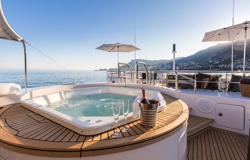 Jacuzzi with champagne on the sundeck of superyacht AIR