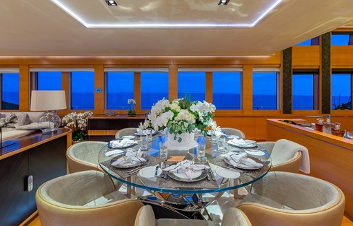 Circular dining table and seating onboard charter yacht DB9
