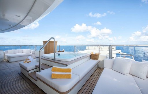 deck Jacuzzi surrounded by sunpads on board super yacht SENSES