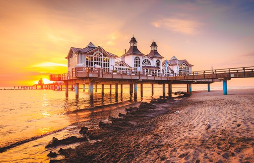 Famous Sellin Seebruecke in beautiful golden morning light at sunrise, Ostseebad Sellin tourist resort, Baltic Sea region, Germany