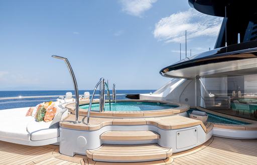 Deck Jacuzzi with adjacent sunpad onboard charter yacht KISMET