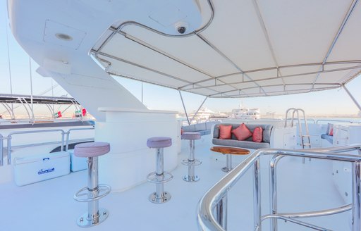 wet bar with Jacuzzi beyond on board charter yacht DXB 