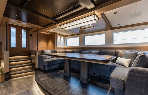 Indoor lounging area with wood paneling 