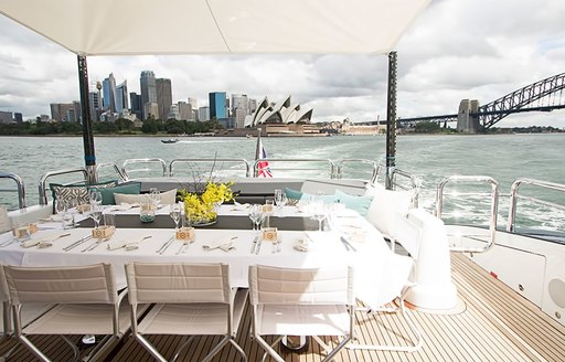 skyline of Sydney is seen from aft deck of luxury yacht QUANTUM 