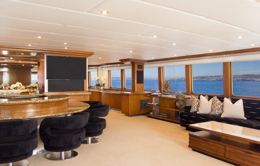 salon and bar in main salon on board motor yacht TALOS