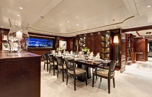 10-seater dining table in main salon of charter yacht Azteca II 