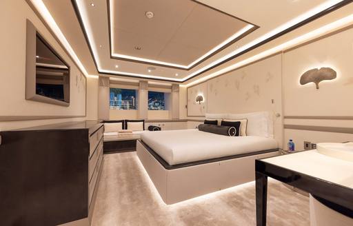 Double guest cabin with central berth and storage onboard charter yacht LUNA
