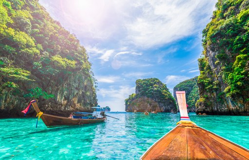 Wooden boats floating in Thailand