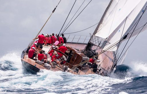 Classic sailing yacht heeling over in rough seas at the Antigua Classic Sailing Regatta