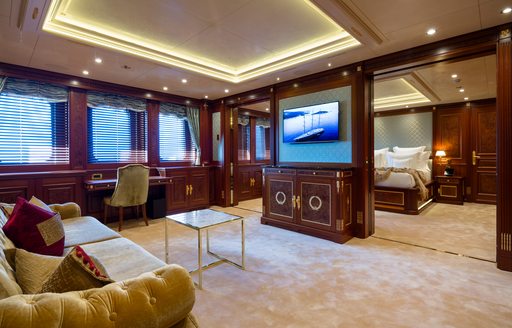 Charter yacht BLACK PEARL master cabin lounge with sofa and flat screen TV