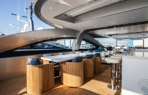 Superyacht charter PERSEVERANCE sundeck with dining table